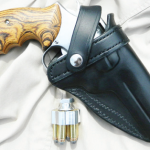 This holster from Holster Pro carries the author's favorite carrying .357 Magnum. (Note Ahrends grips.) The light weight speedloader is from Fice Star Firearms.