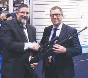 Left to right: author with Ken Pflau Sr., vice president Law Enforcement/ Commercial Operations FNH USA,LLC looking at the SCAR 16S FDE which was a part of the prize package