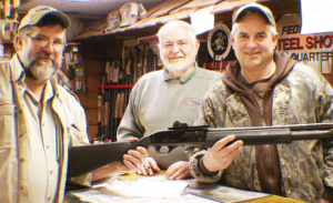 Left to right: author, with owners Miles and Darryl Spitler of Darryl’s Gun Shop, with the FN SLP Standard 12 gauge prize gun
