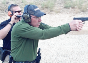 Out in the high desert of Idaho working on smooth, fast presentations, this shooter
is in motion from the high ready to full arm extension.