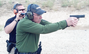 Out in the high desert of Idaho working on smooth, fast presentations, this shooter is in motion from the high ready to full arm extension.