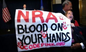 Protesters from Code Pink (pictured above) crashed the nationally televised NRA press conference last December.