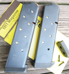 Brownells .45 ACP 1911 magazines; 8-rounder with removable base pad  (left), 7-round mag with screw on base pad (right)