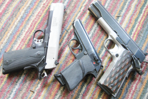 From left to right: Iver Johnson 22LR  conversion on a Kimber Rimfire Target frame, a Walther PPKS in 22LR, and Colt Ace Conversion unit on an aftermarket aluminum frame