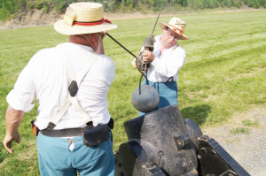 The crew of the 3rd US Artillery, (left to right) Frank Potts and Jimmy Murray, carefully loads their siege mortar during the mortar matches at the North-South Skirmish Association’s 127th National Competition held at Fort Shenandoah, VA, in May. Over 50 mortars competed in that unique match. (N-SSA photo by Bruce Miller)