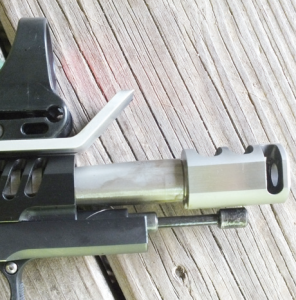 STI Steel Master fitted with a muzzle brake. The aluminum blast shield protects the lens of the C-More sight