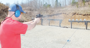 Daniel Hecht, a master class shooter, firing the STI Steel Master