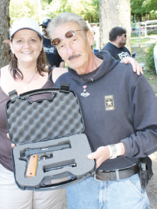 Terri Podraza of Seabeck, WA walked away with a Rock Island Armory .45-caliber Model 1911 pistol, donated by Jim Beal, a veteran open carry activist in Washington State