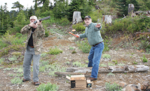 With Brian Lull at the ready, Workman gets ready to toss a clay target. Serious wingshooters should be doing this already in preparation for fall hunting.