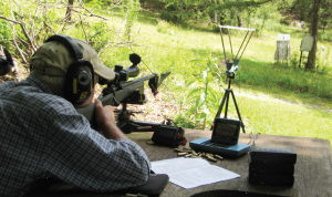 The author at his bench testing loads over both the MagnetoSpeed V2 and his CED chronograph simultaneously.