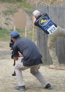 Tommy Thacker of ArmaLite leans out to engage the final target on the IPSC pistol stage. 