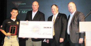 Left to right, Daniel Horner, US Army Marksmanship Unit, match winner and recipient of the $50,000 first prize; Jeff Mosher, Trijicon Director Domestic Business Development; Cole McCulloch, owner of Peacemaker, and John Rupp, Trijicon VP of Business Development.