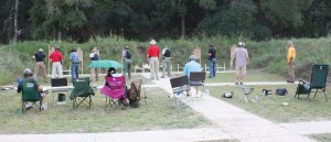 Students shooting one-handed at four yards. Lamberson is the range officer in the center. 