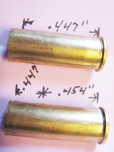 The upper .44Magnum case was re-sized in an old style, single ring carbide sizing die. The entire case body measures .447”. The lower case has been resized in the Redding Dual Ring sizer. Only the forward part of the case is sized to hold the bullet at .447” while the remaining case body is sized to .454” for a better chamber fit.
