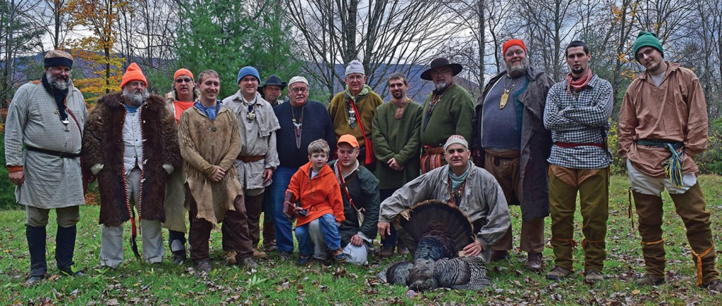 Squirrel Camp 2014 included (front row) the newest member, Lucas Fulmer, his father, Curt, and Norm Hoover, who is proudly displaying the turkey gobbler harvested this year. (Photo by Rich Clemons) 