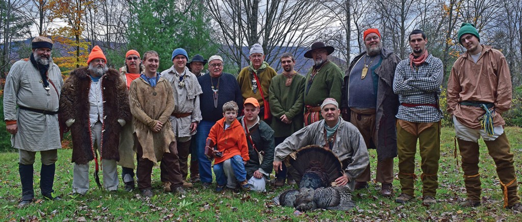 Squirrel Camp 2014 included (front row) the newest member, Lucas Fulmer, his father, Curt, and Norm Hoover, who is proudly displaying the turkey gobbler harvested this year. (Photo by Rich Clemons)