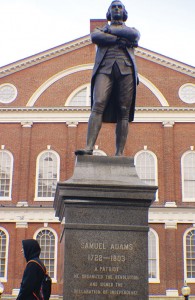 Sam Adams statue in front of Faneuil Hall, Boston. Legend on base reads: “He organized the revolution and signed the Declaration of Independence.”
