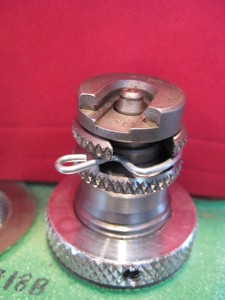 The shell holder die installed in the turret of a Redding T-7 press with a RCBS #10 shell holder (for .223 cases) in place. The swage punch can be seen protruding up through the shell holder. If a case was in the shell holder the swage punch would be in the primer pocket.