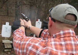 The recoil of the Ruger SR1911 Lightweight Commander is “snappy” compared to a full sized Government Model. Shown here in full recoil, the alloy framed LWC is a handful but is still quite manageable. It requires a firm grip and good technique. 