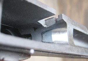 This photo shows the Titanium feed ramp insert as well as the casting residue left in the slide stop notch of the frame.  