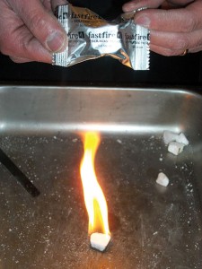 Fastfire burns endothermically to produce a hot, but smokeless flame. 