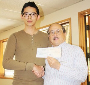 Redmond, WA, gun shop proprietor Roy Lin (left) contributed $1,000 to the reward fund spearheaded by SAF and CCRKBA’s Alan Gottlieb to find the killer of a longtime member of the Washington Arms Collectors. (Dave Workman photo)