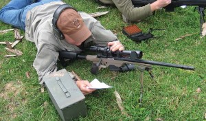 Author’s son, Brock Markwell, consults the DOPE sheet and dials elevation for a long shot with the MVP LC. The rifle performed extremely well with the author’s handloads using Sierra 77-gr. BTHP bullets.  