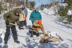 The Cree pass along their wilderness survival and income skills to younger generations as in this trap setting demonstration which is part of the course.
