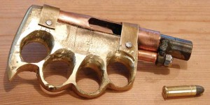 (Snappy Cappy Photos) This zip gun is an unusual design, brass knuckles with a pipe barrel sized for a .38 round. 