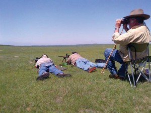 The author (left) and Bob Sumner busting dogs “out yonder” while Rick Miller spots.  