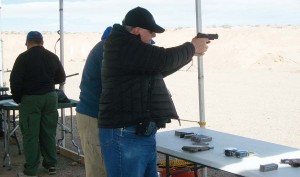 The author firing the Colt Commander on the Range the day before the show. 