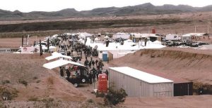 A view of the lower portion of Media/Industry Day that precedes the SHOT Show shown in operation at the huge Boulder City Gun Club. Some of the firing butts are to the left, others to the right and shotgun ranges were further up the hill behind this view. 