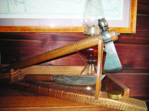 The Lewis & Clark commemorative hawk and knife with a framed copy of L&C’s map in the background.