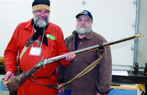 The author, left, and Buddy Townsend who just finished a .54 cal. rifle from a barrel made during the previous year. (Photo by Becky Waterman)