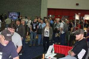NRA members flood through the doors at the opening of the 2016 convention in Louisville’s Kentucky Exposition Center.