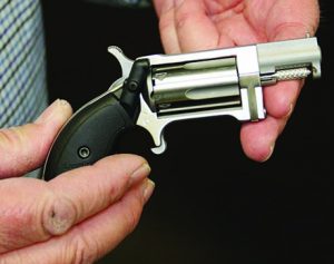 There are many standard and customized accessories for this revolver, including this popular Laserlyte grip sight. (NAA photo)