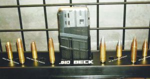 Various .510 Beck cartridges along with their respective projectiles. The magazine is a Lancer designed especially for the .510 Beck cartridge.