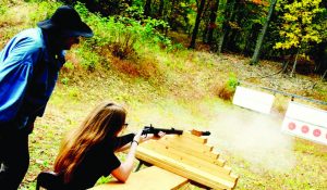 Wes Griest instructs a new shooter at the beginner’s bench. (Jeffrey Robison photo)