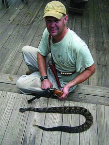 This rattlesnake was shot by the author’s son on Allegheny Mountain while setting up steel targets for the Allegheny Sniper Challenge. Brock often carries a 6 1/2 inch S&W Model 29 loaded with CCI .44 shot shells when out and about in the Summer.Chest holster is by Badlands Leather.