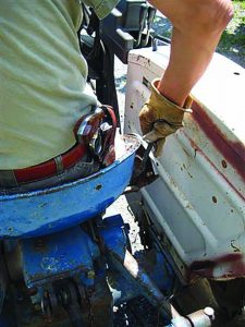 Everyday handguns are easily carried when working the tractor. This is the author’s S&W 651 .22Mag Kit Gun holstered up on the old Ford.