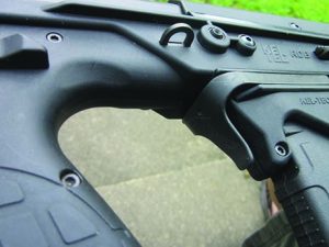 The manual safety, on both sides, is at the top of the hand-grip. It is shown here off-safe.