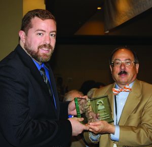 Steven Gutowski (left), a writer at the Washington Free Beacon, was presented with the SAF Journalist of the Year for 2016 award by founder Alan Gottlieb.