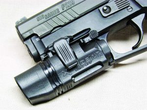 This Xiphos is mounted on a Sig P229 and you can see the easy access switch.