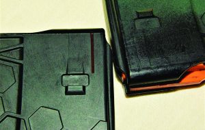 Author ran these Hexmags for most all of 2016 in the Tavor. The Hexmag2 is all black; it has grooves to accept a stripper clip where the original did not.