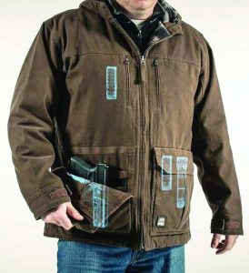 This photo supplied by Berne Apparel shows how the Adder System work jacket offers space for a handgun as well as additional magazines or speedloaders accessible through the tear-away flaps where pockets would ordinary be.