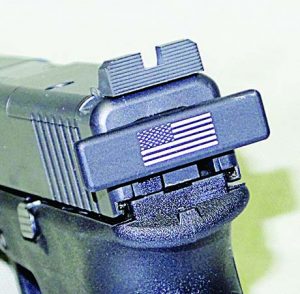 Close-up of the Tac Rack and after market rear sight with its wide notch. 