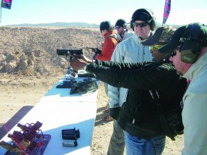 The author’s companion, Shauna Washington, tries out the Hechler & Koch all-new 9 mm SP5K at Media Day.