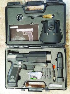 The Canik 9TPSFx with its lockable box, holster, red dot mounts and all the accessories.