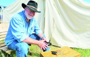 Allen Cunniff in front of our tent at Quigley shoot in Montana, getting ammo reloaded.