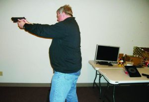 Lt. Dave Case tries some shooting with the MantisX Firearms Training System.
